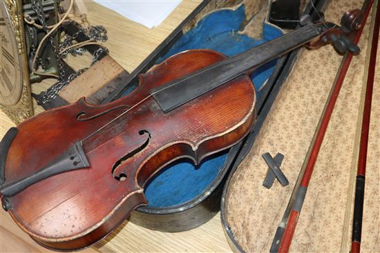 A German Strad style violin and a small violin and two bows